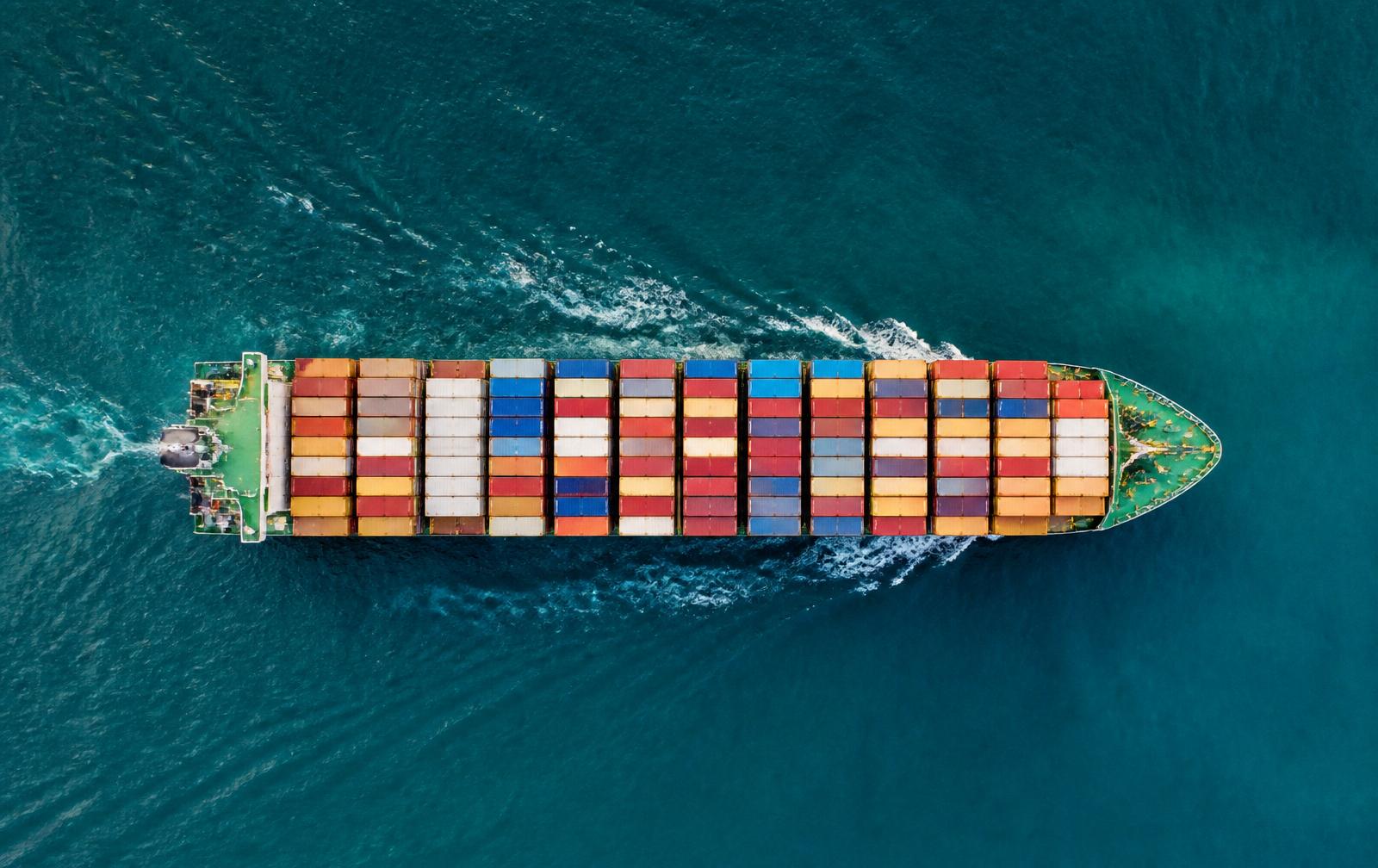Container ship at sea from above.